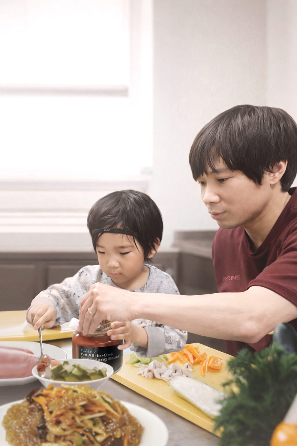 Chef Min and his son cooking together with K-DINE gochujang sauce